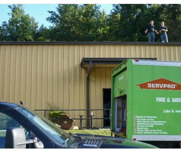servpro truck in front of damaged commercial property