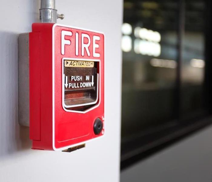 Fire alarm system on an office wall
