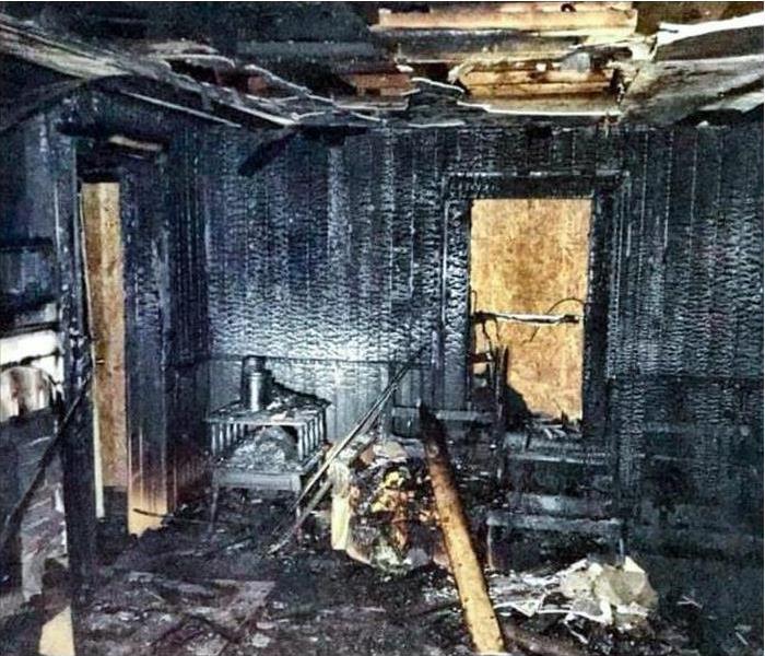 inside of a home damaged by fire, ceiling and walls burned