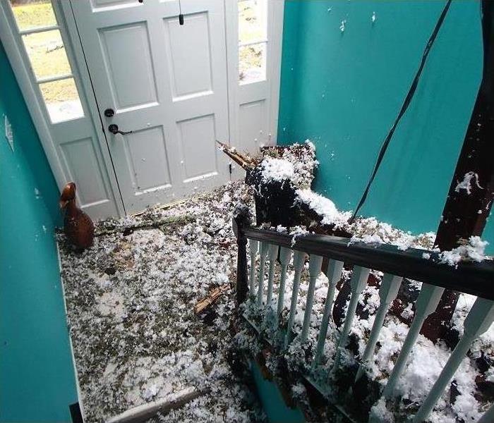 Debris inside a Hendersonville, NC home, after tree had fallen over the house